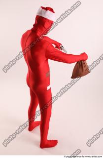 JOEL_ADAMSON CHRISTMAS VALLAIN WITH GUN AND BAG